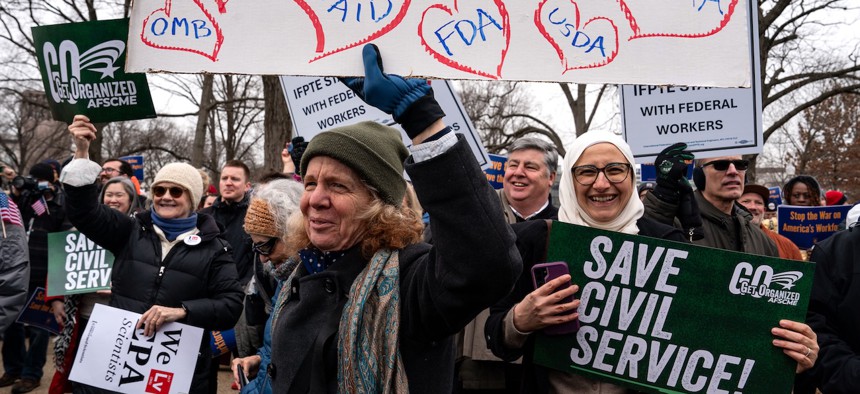 People gather for a "Save the Civil Service" rally hosted by the American Federation of Government Employees (AFGE) outside the U.S. Capitol on Feb. 11, 2025. Unionized federal workers and members of Congress denounced President Trump and his allies including Elon Musk, head of the Department of Government Efficiency (Doge) for purging federal prosecutors, forcing out civil servants with dubious buyouts, and attempting to shutter USAID, all while branding government employees the "enemy of the people."